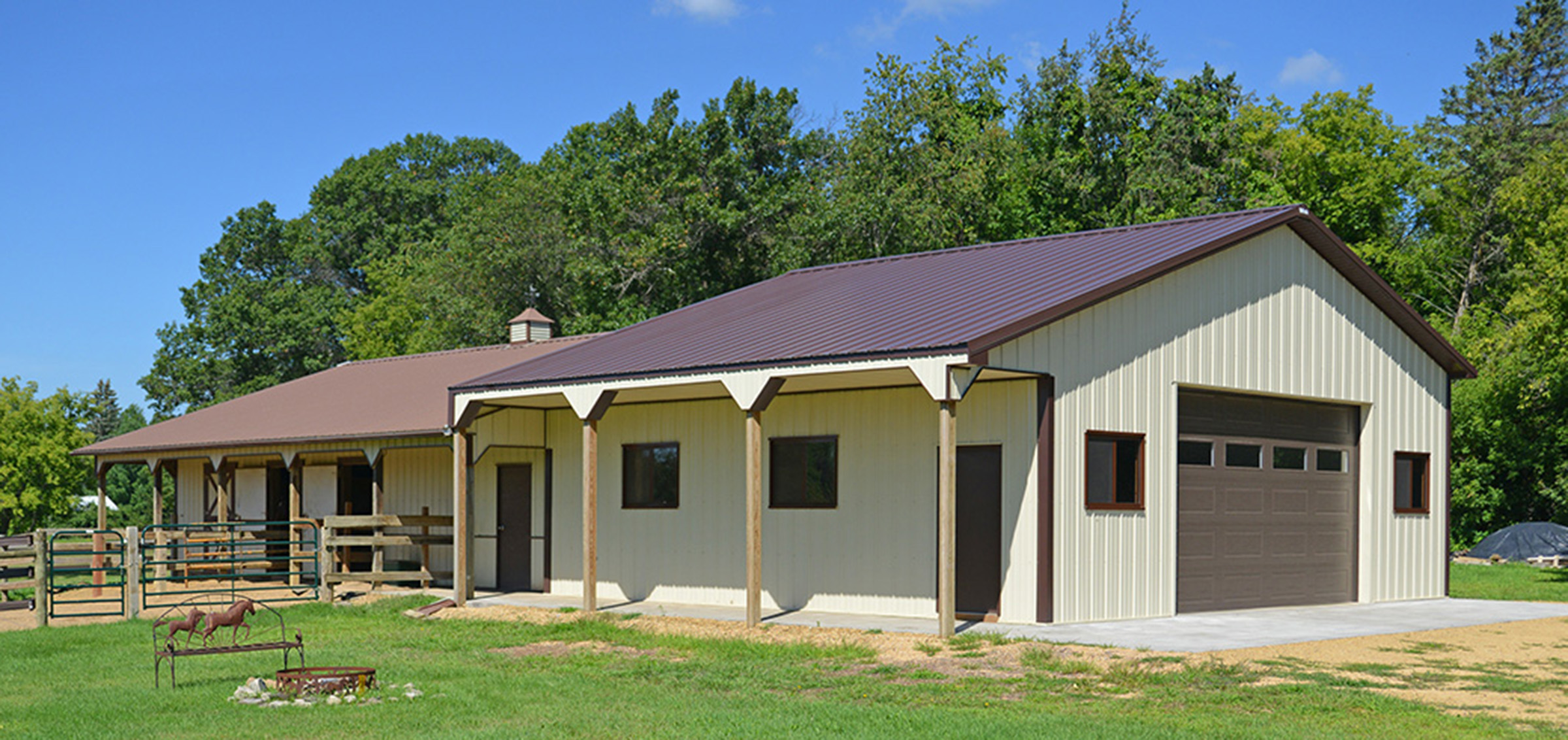 cream and brown post frame equine building